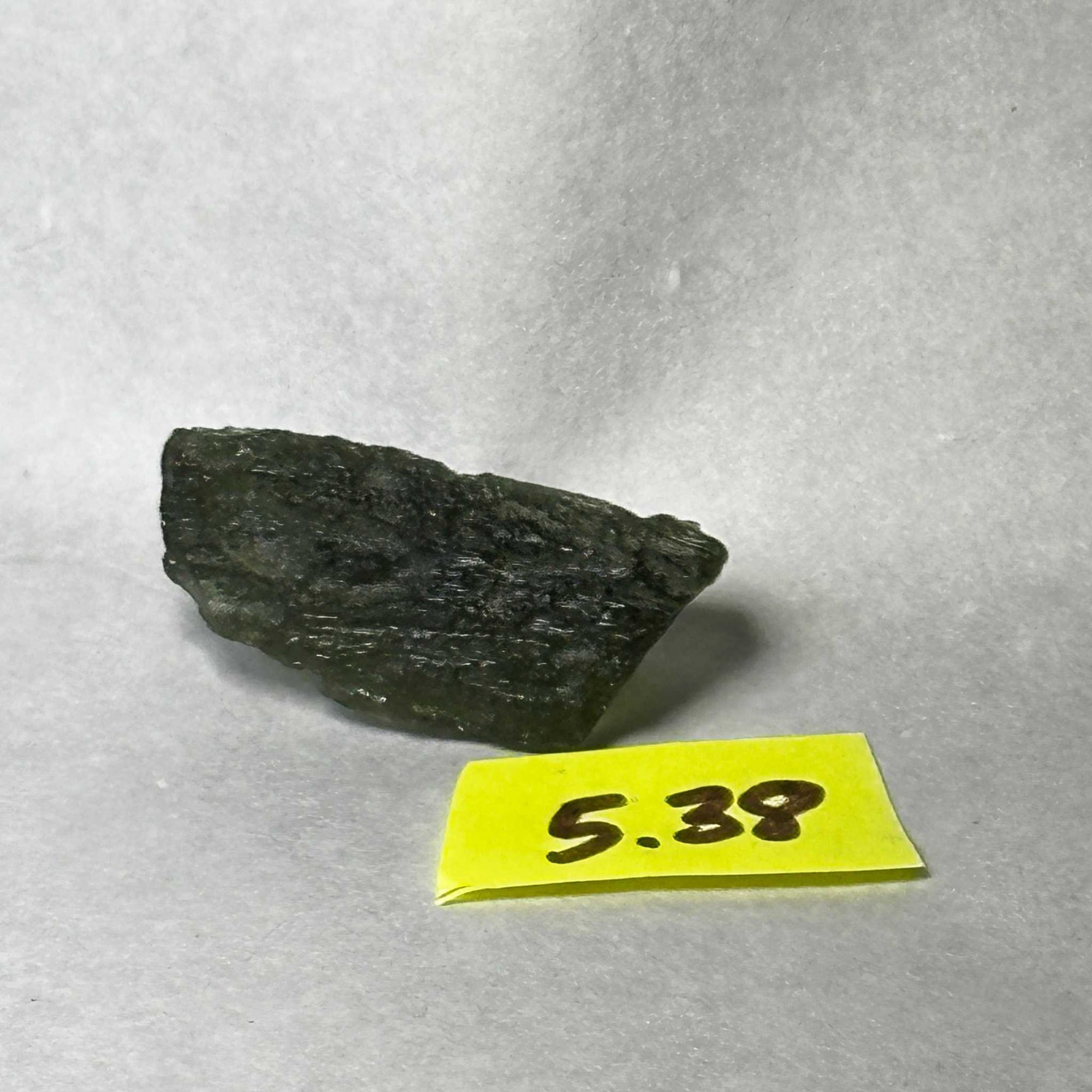 Raw Moldavite tektite weighing 5.38 grams from the Czech Republic with natural dark green texture