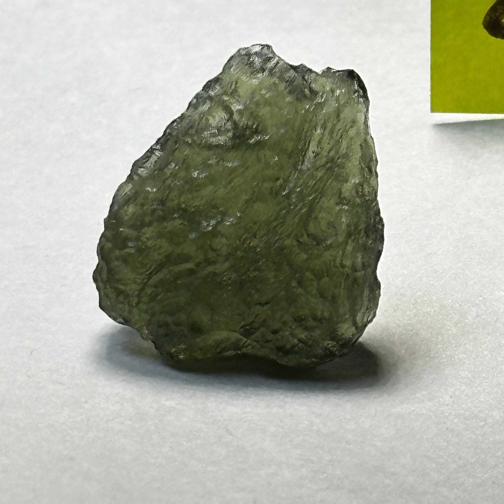 Raw translucent green Moldavite tektite weighing 4.21 grams from the Czech Republic