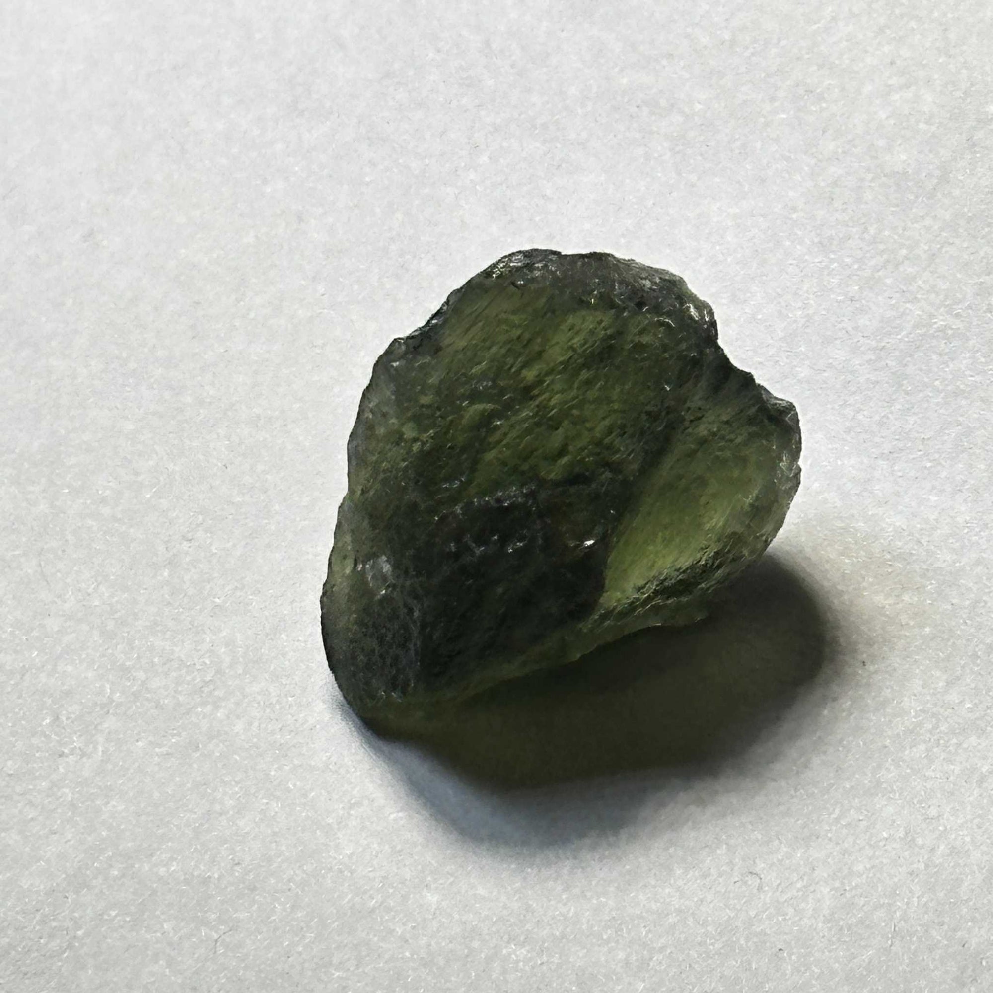 Raw translucent green Moldavite tektite weighing 4.35 grams from the Czech Republic