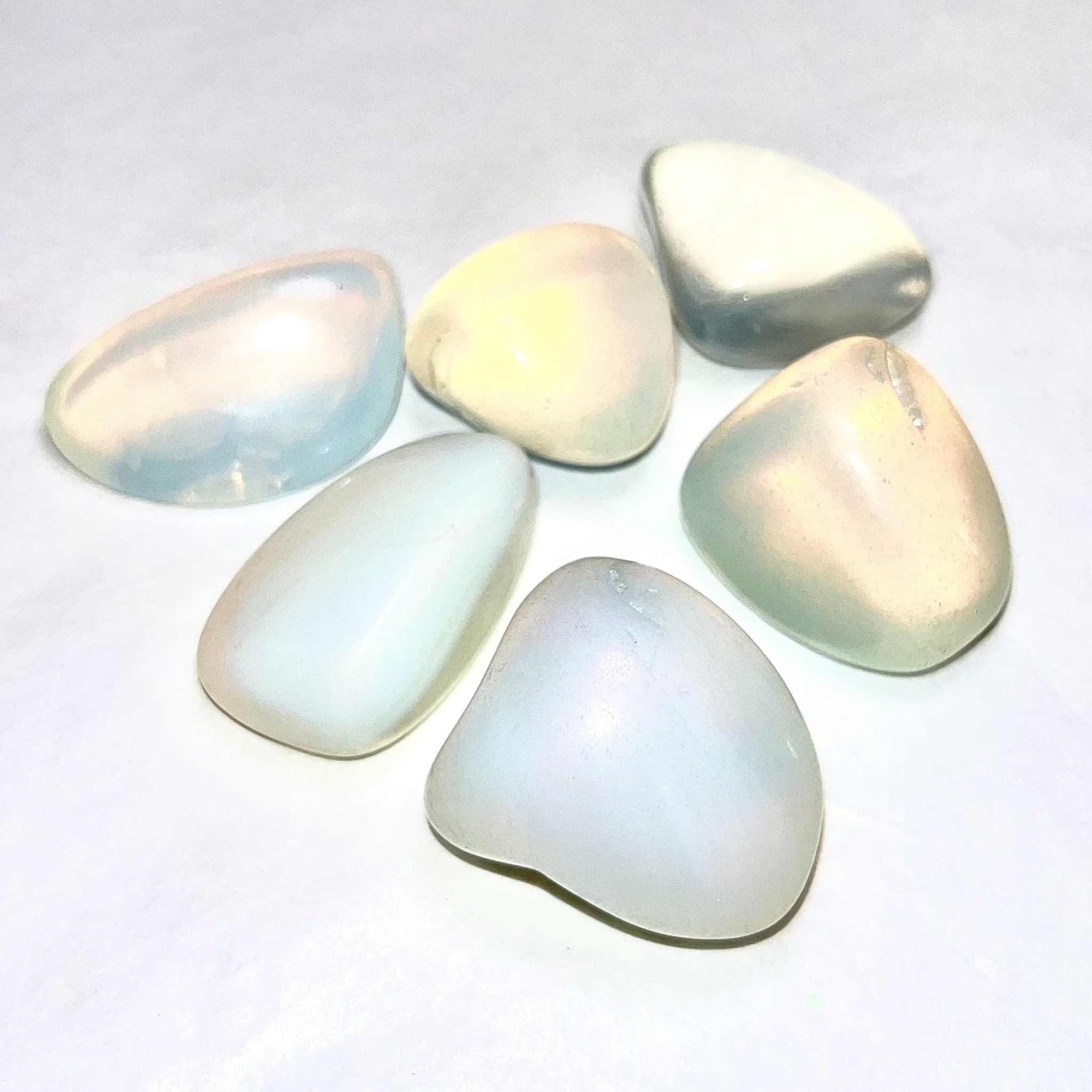 Opalite tumbled stones with iridescent glow.