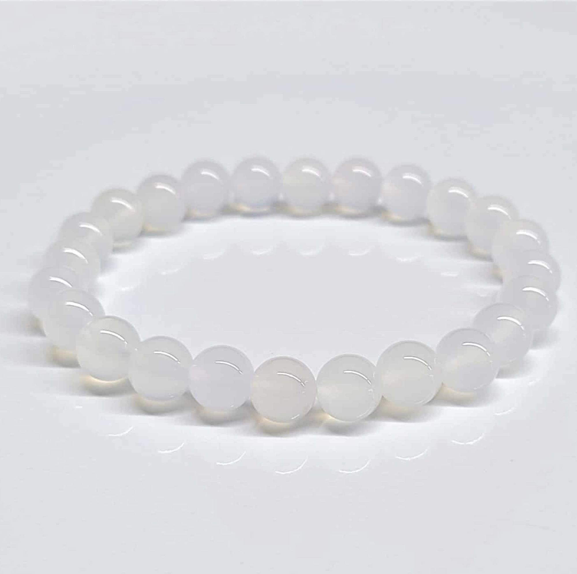 Chalcedony Stackable Bracelet with translucent round beads for spiritual growth and harmony.