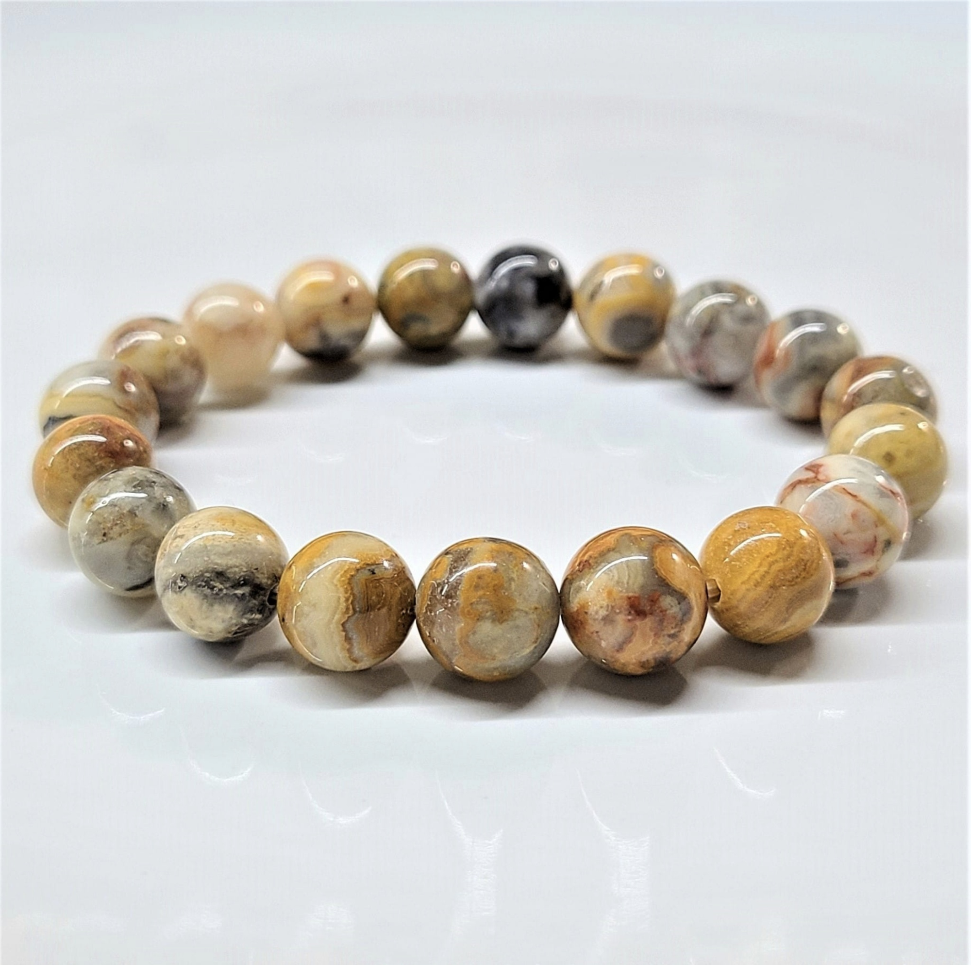 Crazy Lace Agate round bead stackable bracelet with natural multicolor swirling patterns.