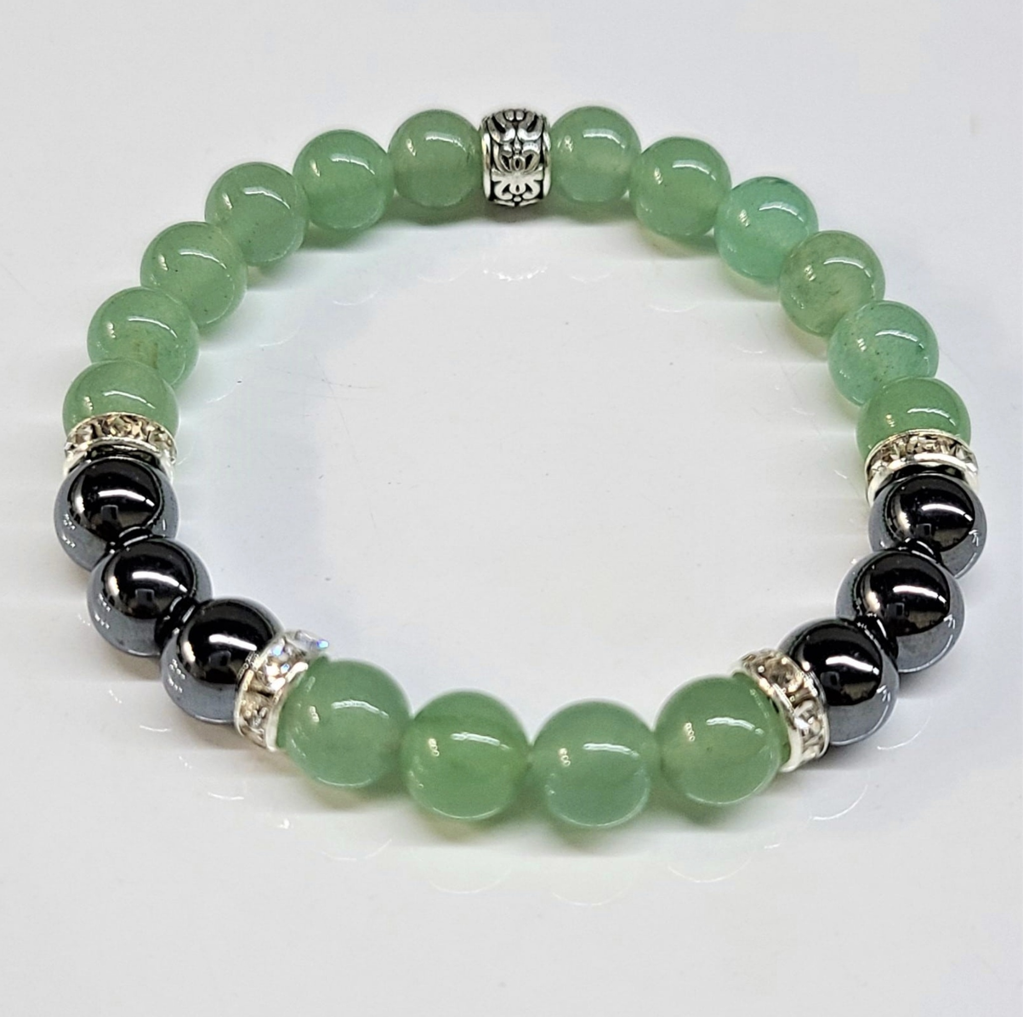 Aventurine and hematite round bead stackable bracelet with silver accents for balanced prosperity and grounding energy.