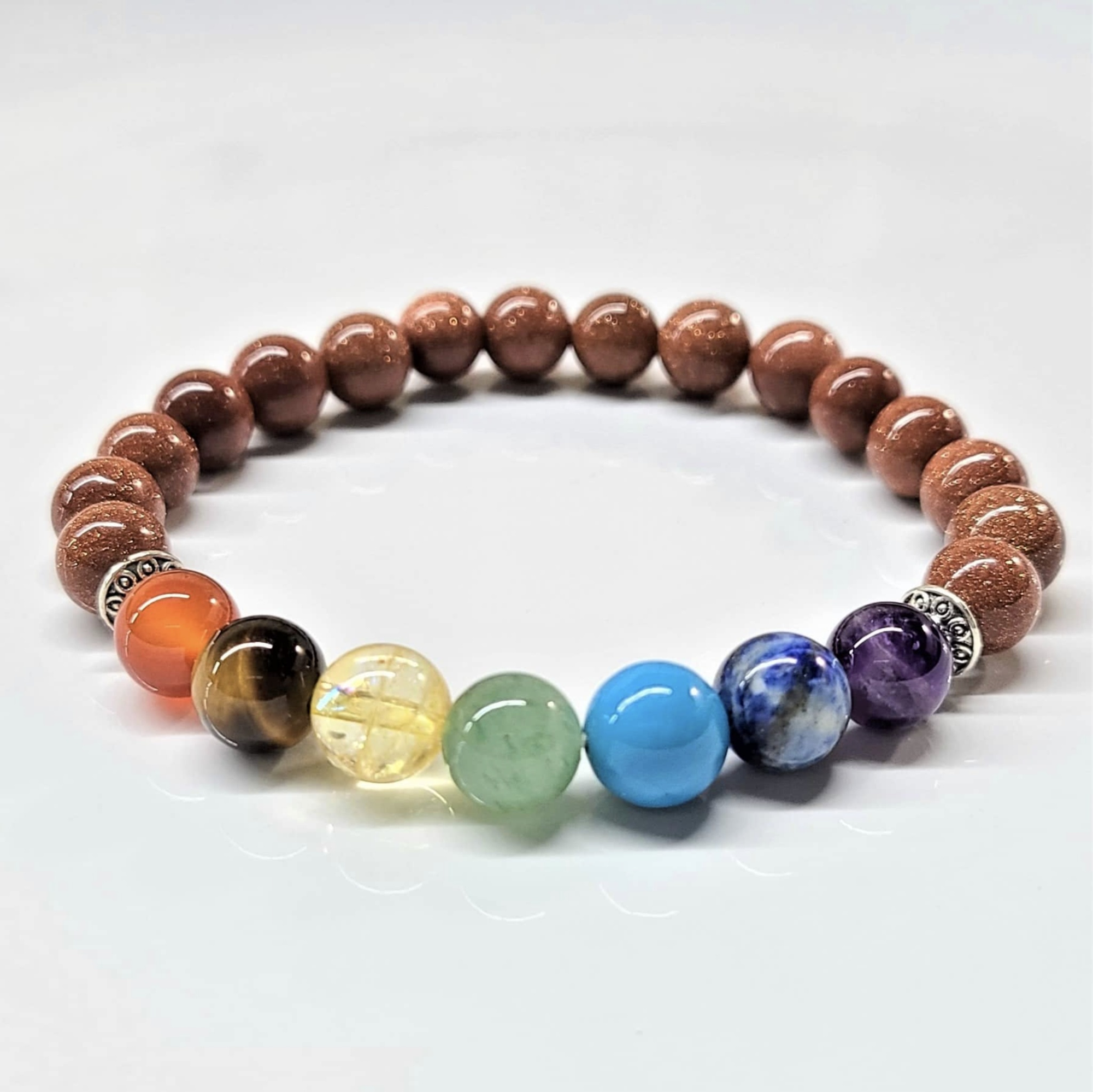 Goldstone Chakra Bracelet with 8mm round beads featuring seven colorful chakra stones for energy balance and spiritual harmony