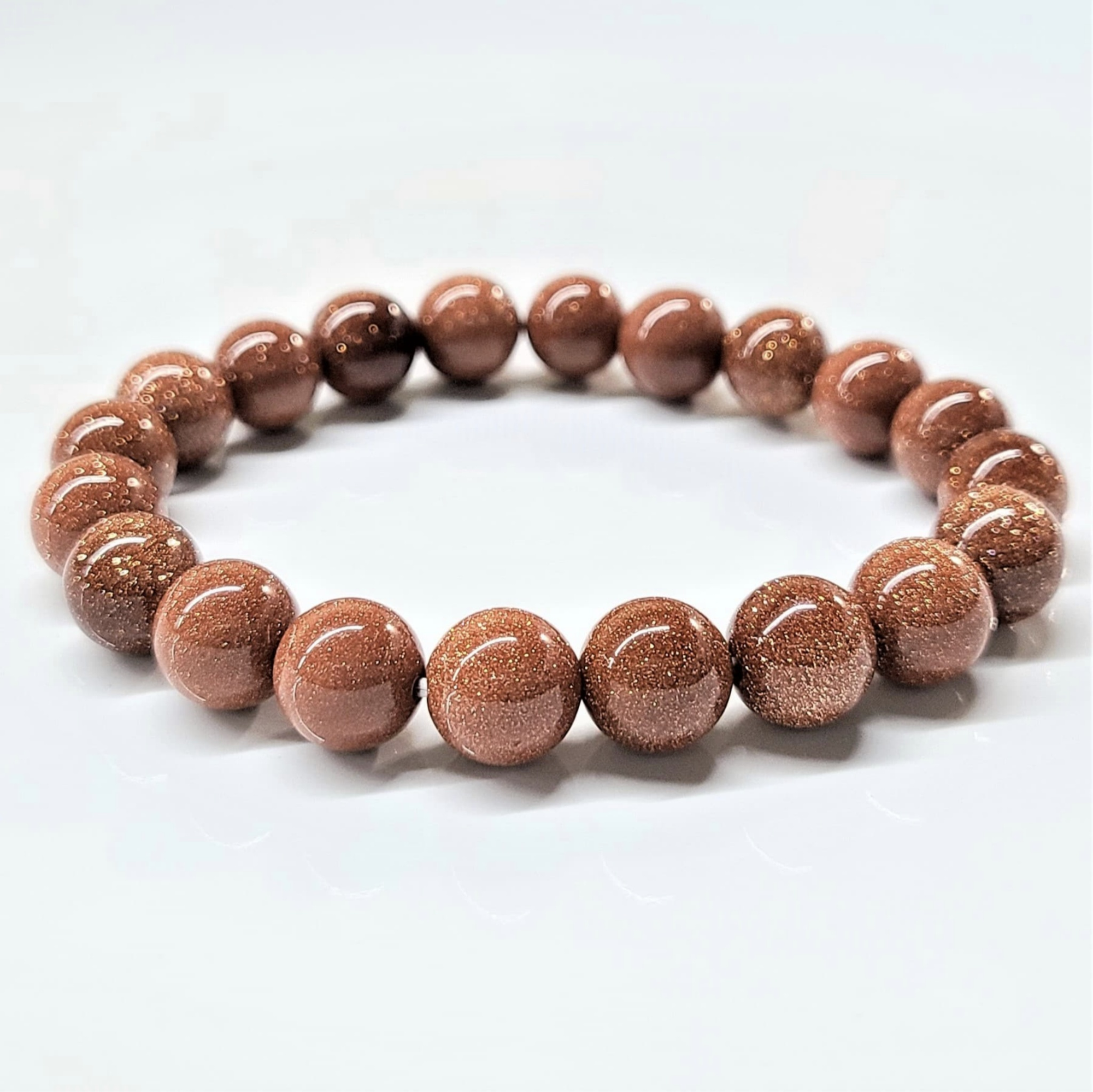 Goldstone round bead stackable bracelet with glittering reddish-brown synthetic gemstone beads
