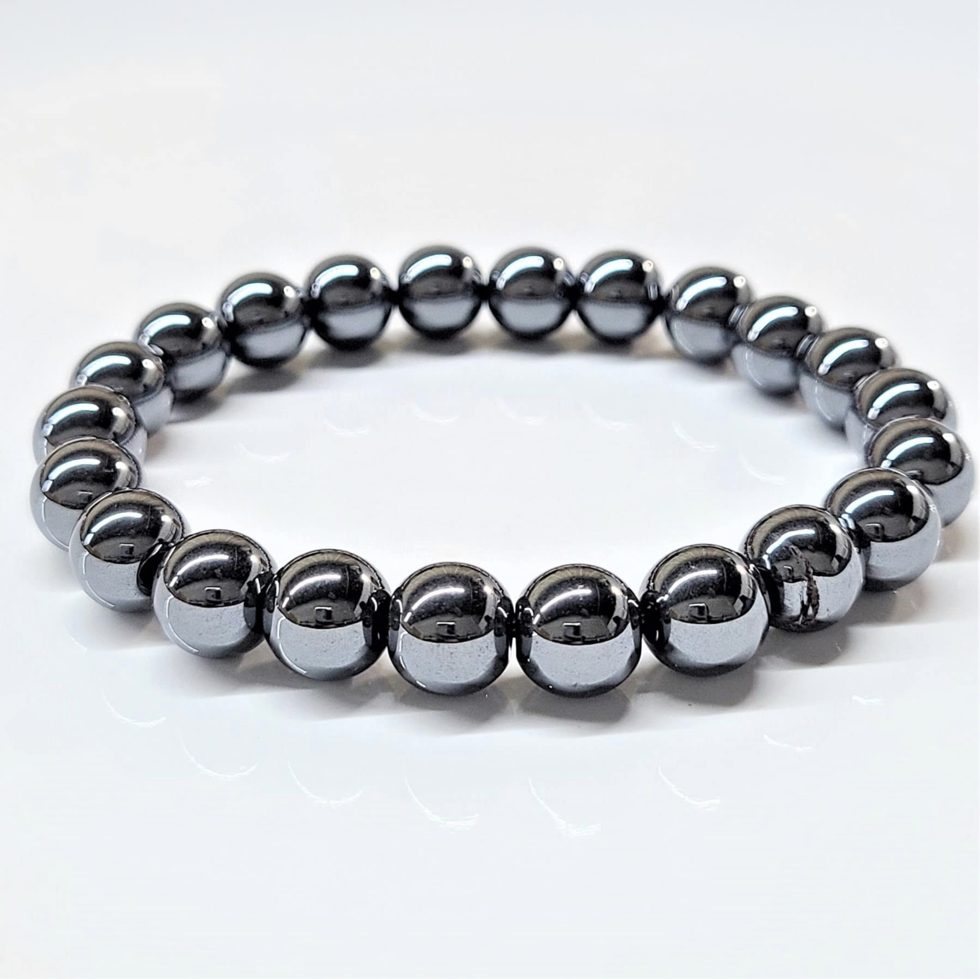 Hematite round bead stackable bracelet with metallic sheen and grounding properties.