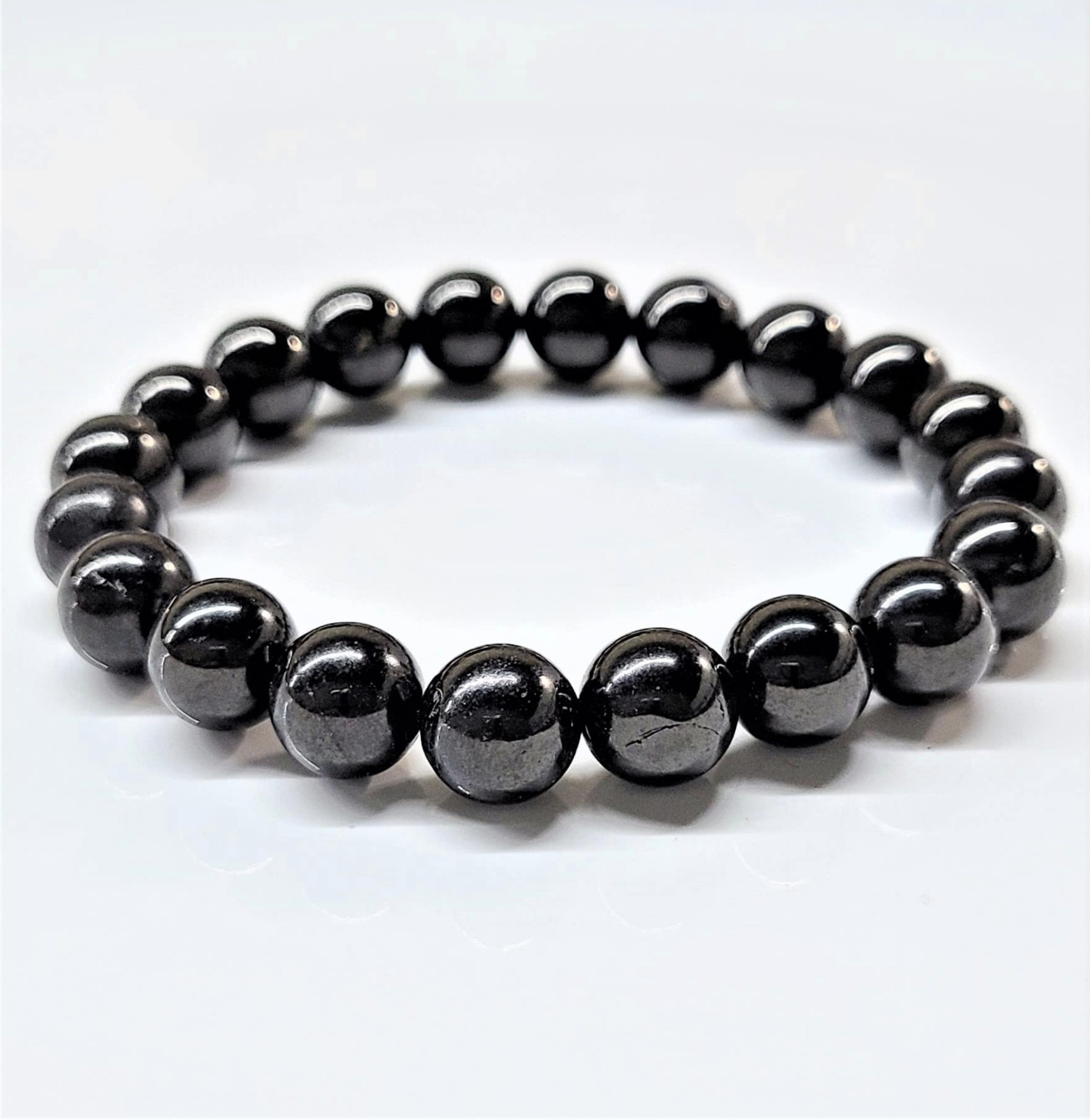 Jet stackable bracelet with round polished black beads for protection and grounding