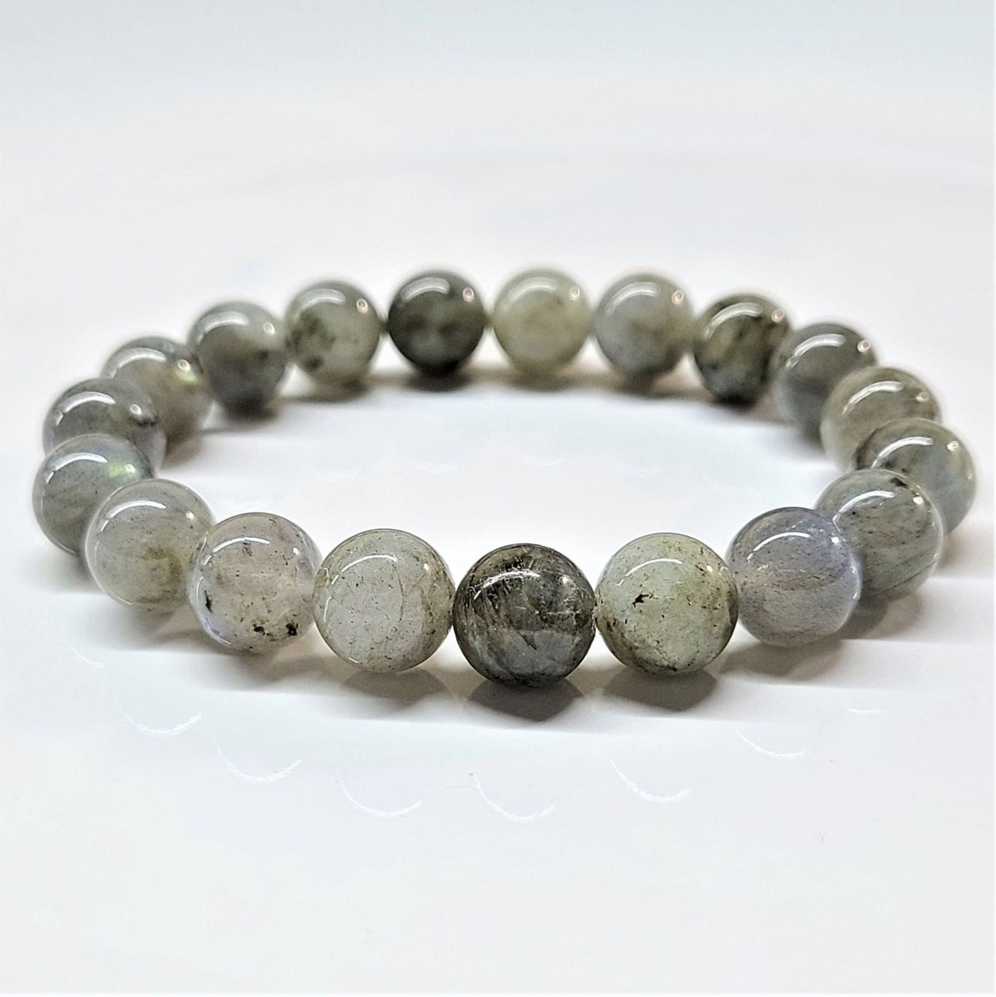 Labradorite stackable bracelet with round iridescent gray beads showcasing natural labradorescence.