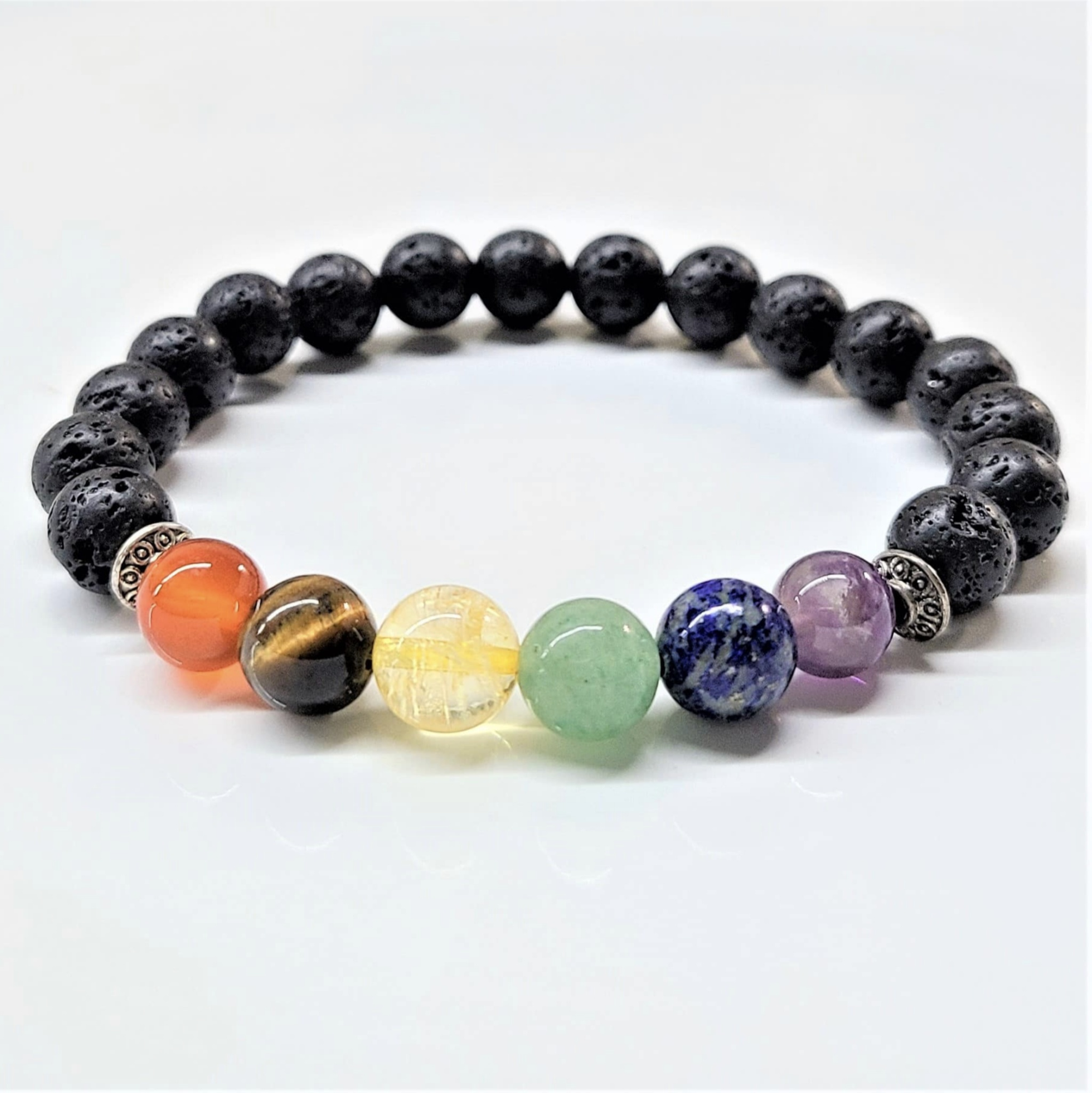 Lava Chakra Bracelet with 8mm black lava stone beads and colorful seven chakra round gemstone beads for spiritual balance and courage.
