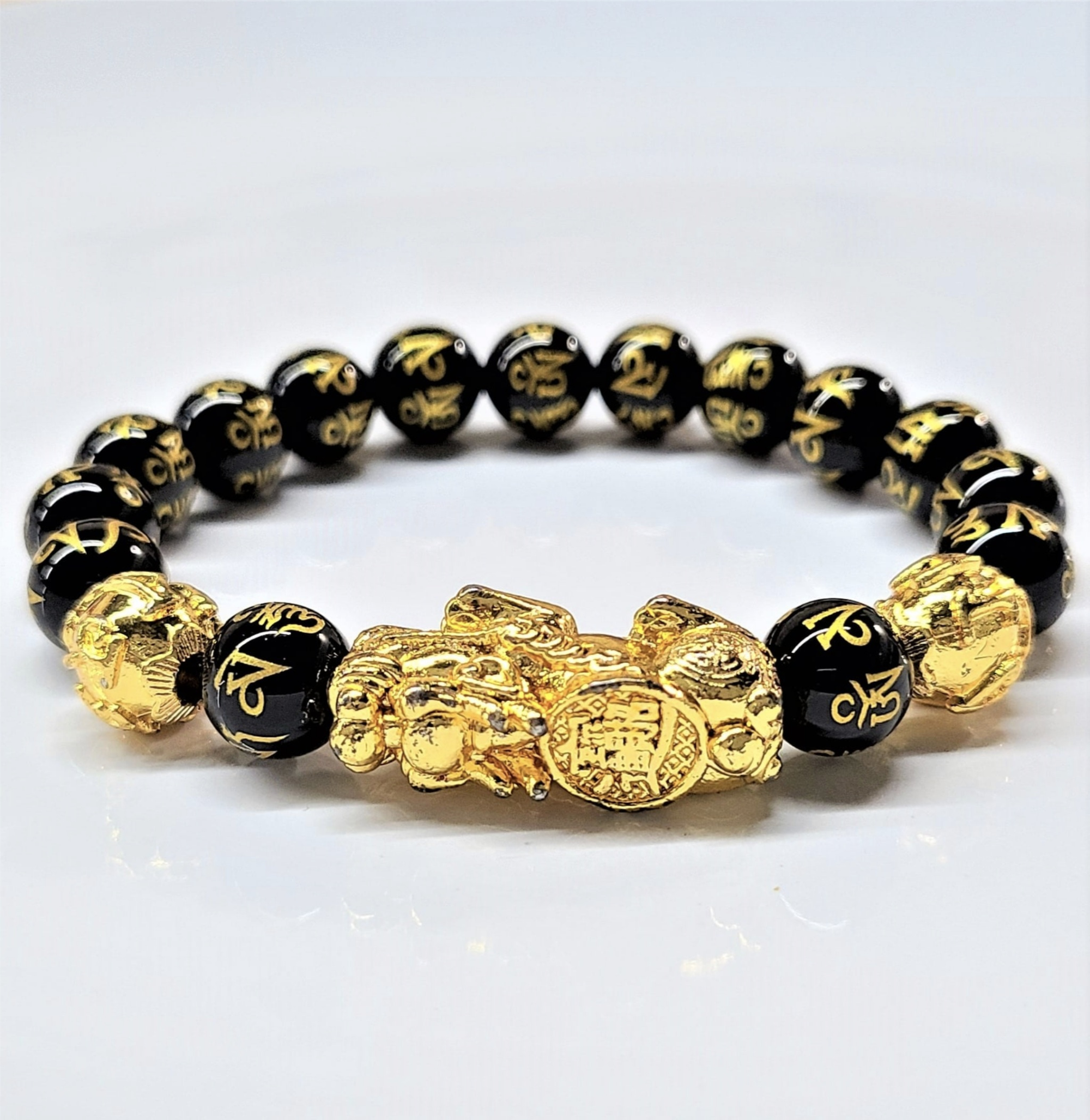 Pi Yao & Obsidian 10mm bead bracelet with gold accents for wealth attraction and protection.