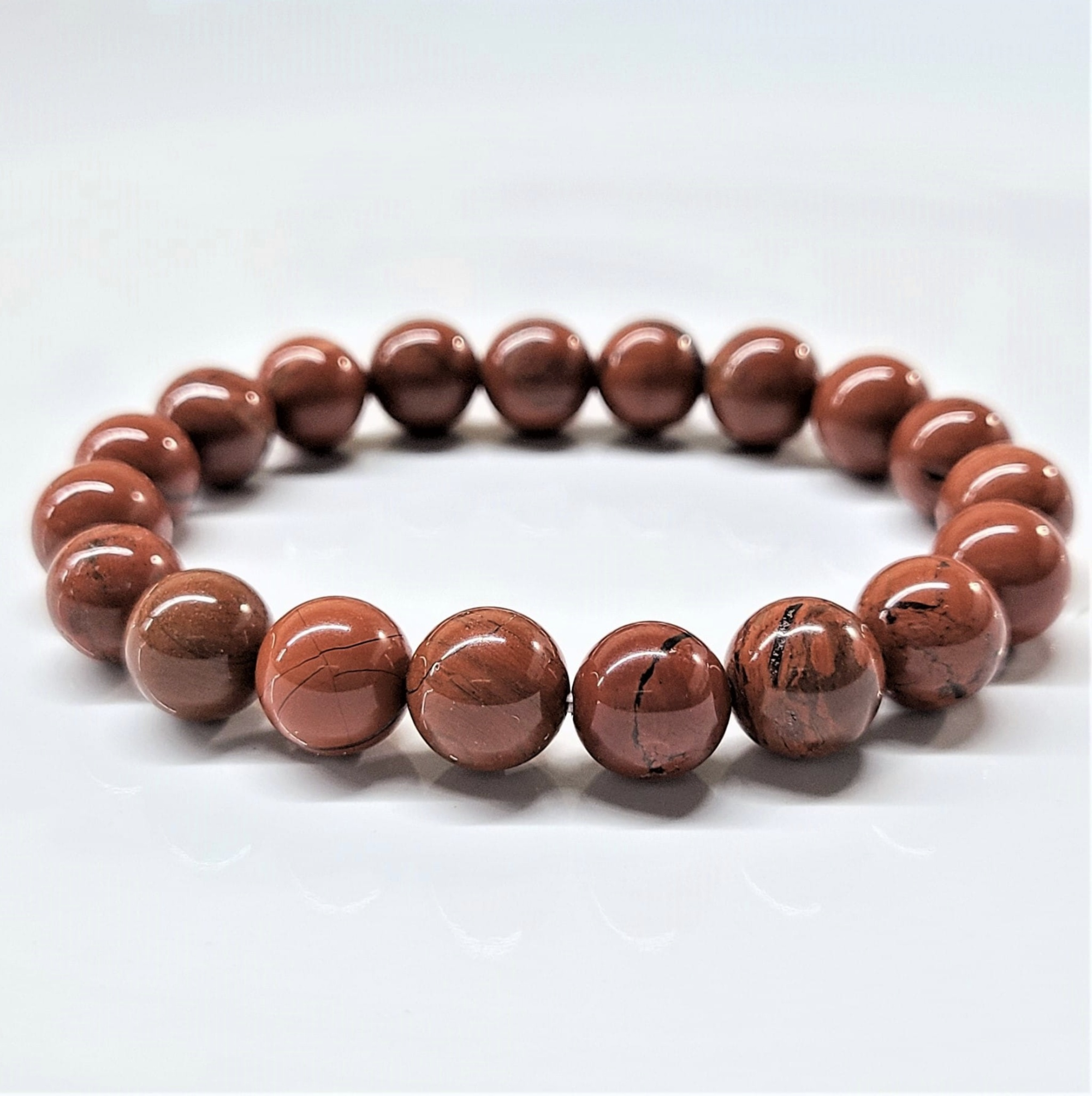 Red Jasper round bead stackable bracelet with polished deep red stones for grounding and vitality