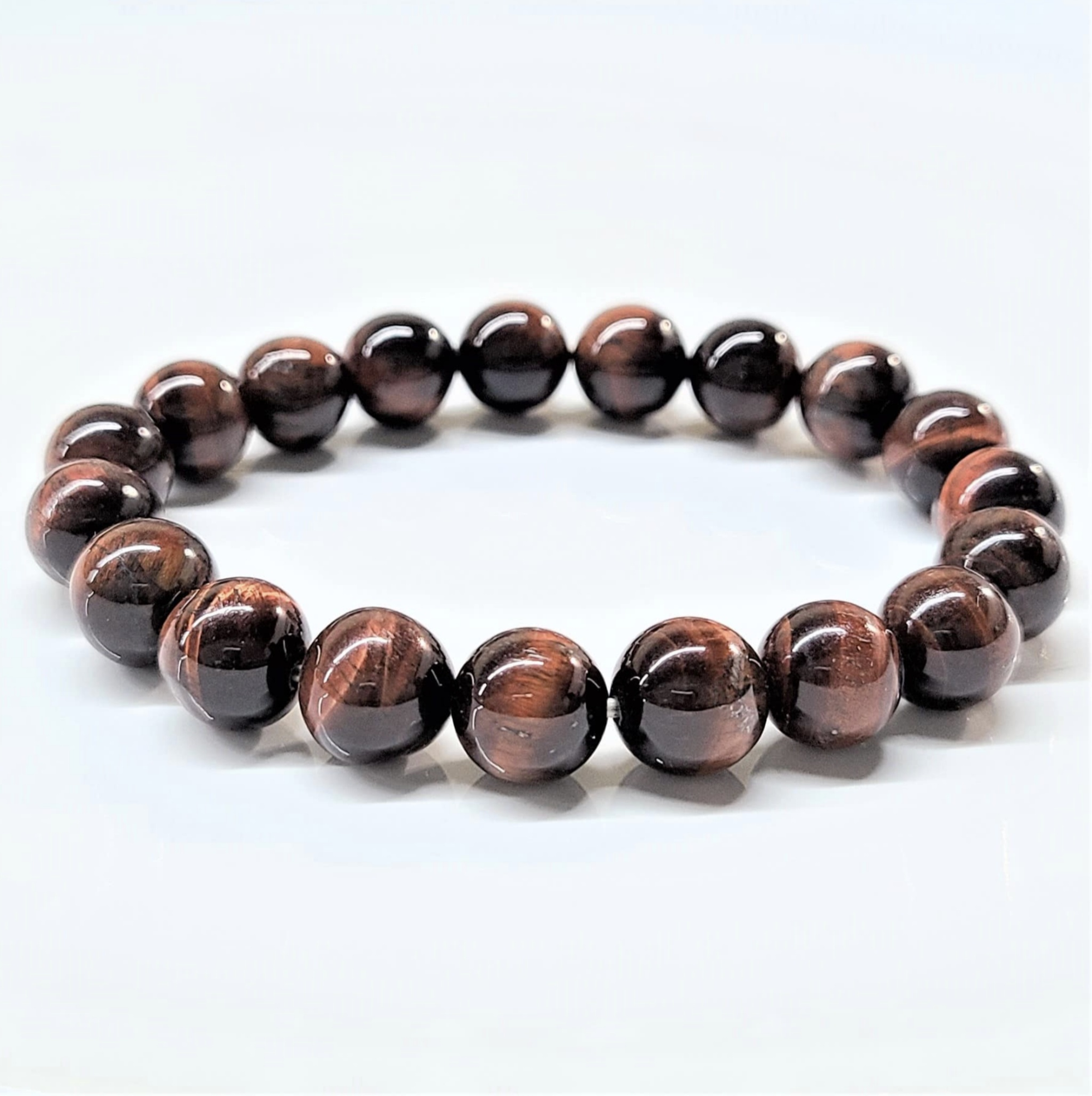 Red Tiger (Dragon’s Eye) round bead bracelet with polished vibrant reddish-brown chatoyant stones