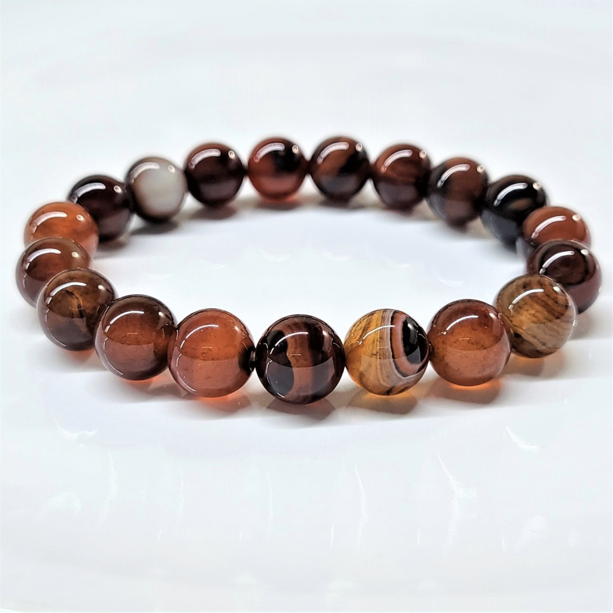 Red Agate stackable round bead bracelet promoting stability, confidence, and grounding energy.