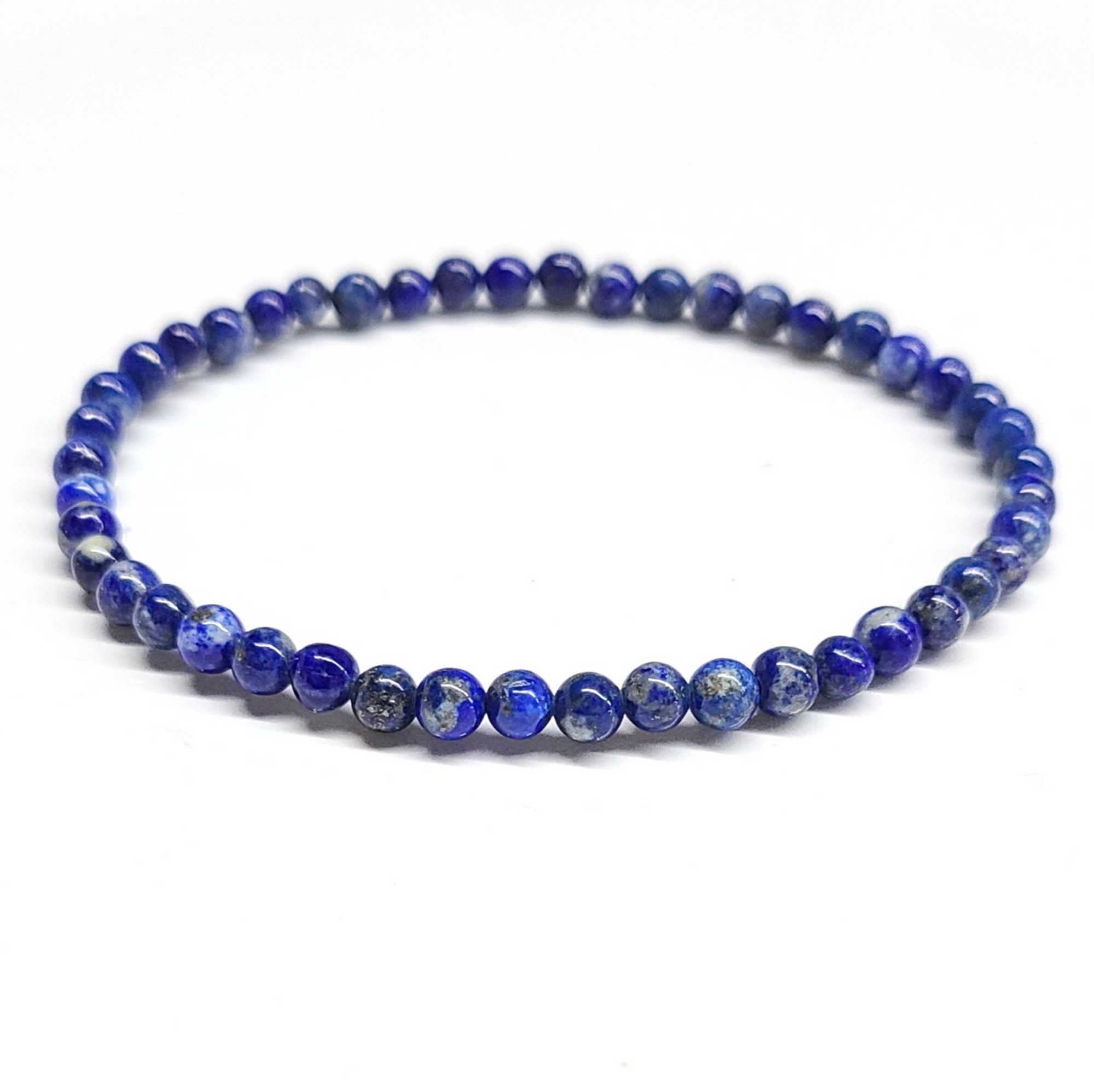 Lapis Lazuli Bracelet 4mm with vibrant blue beads featuring gold pyrite flecks, enhancing spiritual awareness and emotional balance.