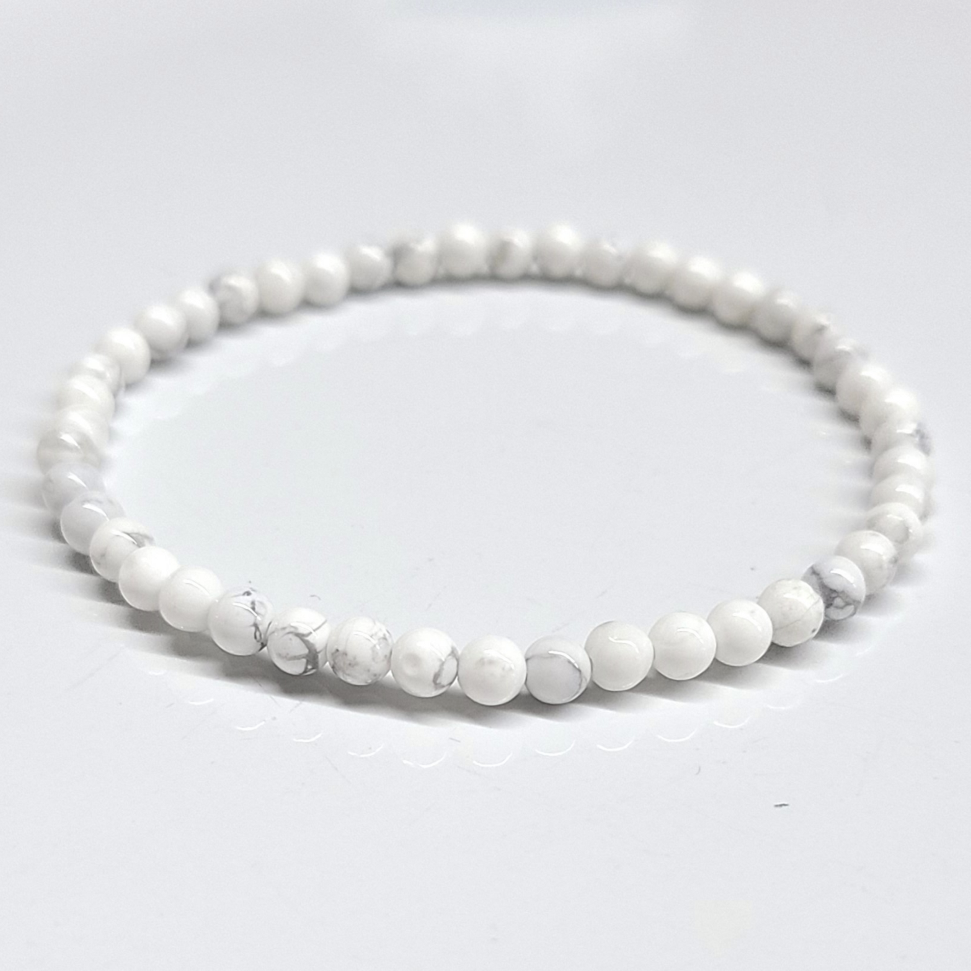 White Howlite Bracelet with 4mm beads offering calming and soothing energy.