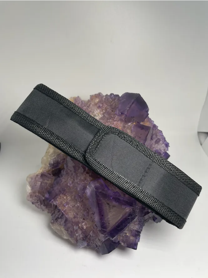 Nylon holster for Gem Torch displayed on a purple mineral background.