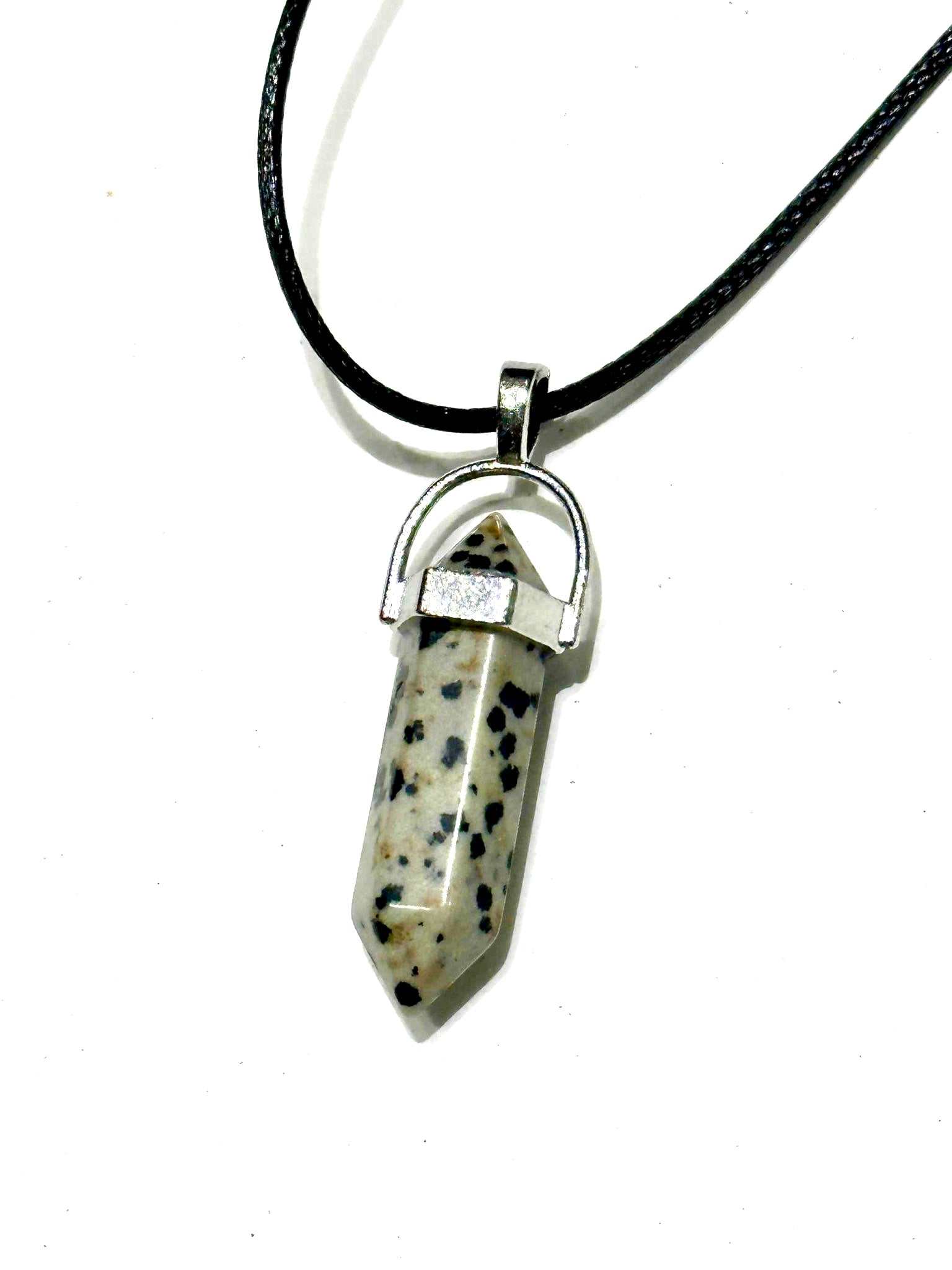 Dalmatian Jasper Bullet Point Necklace with spotted stone pendant and black cord.
