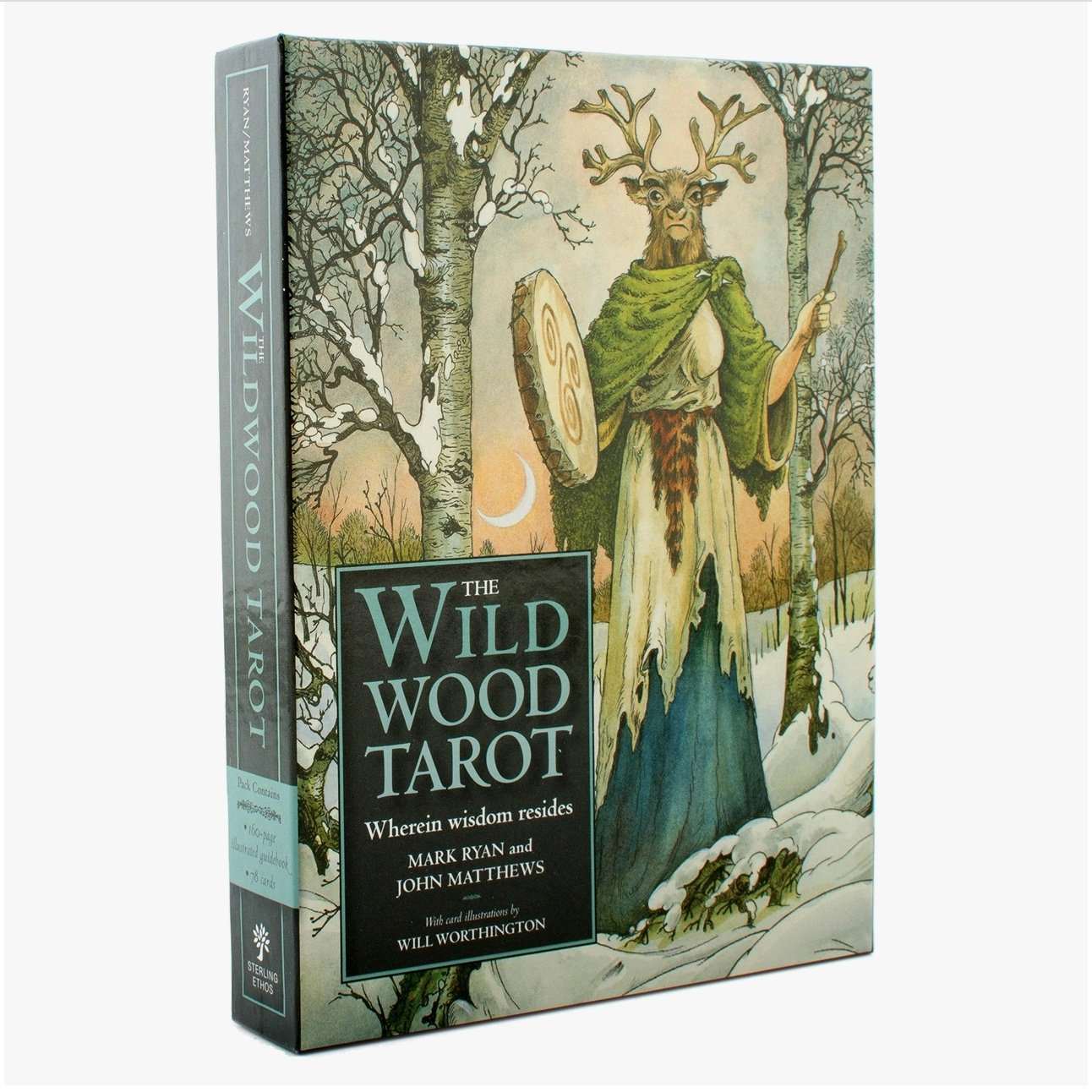 Wildwood Tarot Deck box featuring mystical forest artwork with a robed figure and deer antlers standing among trees in winter.
