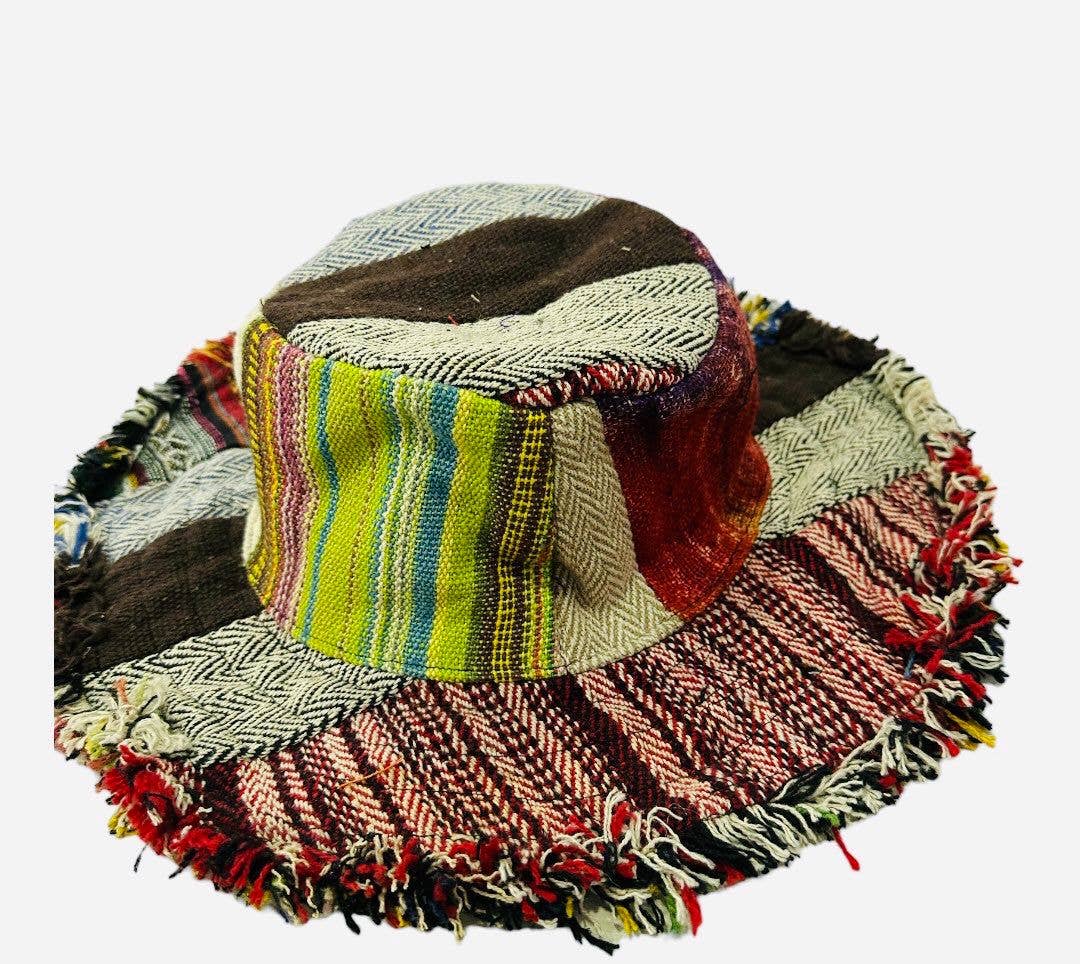 Bucket hat with fringe trim in red, tan, and brown mixed colors.