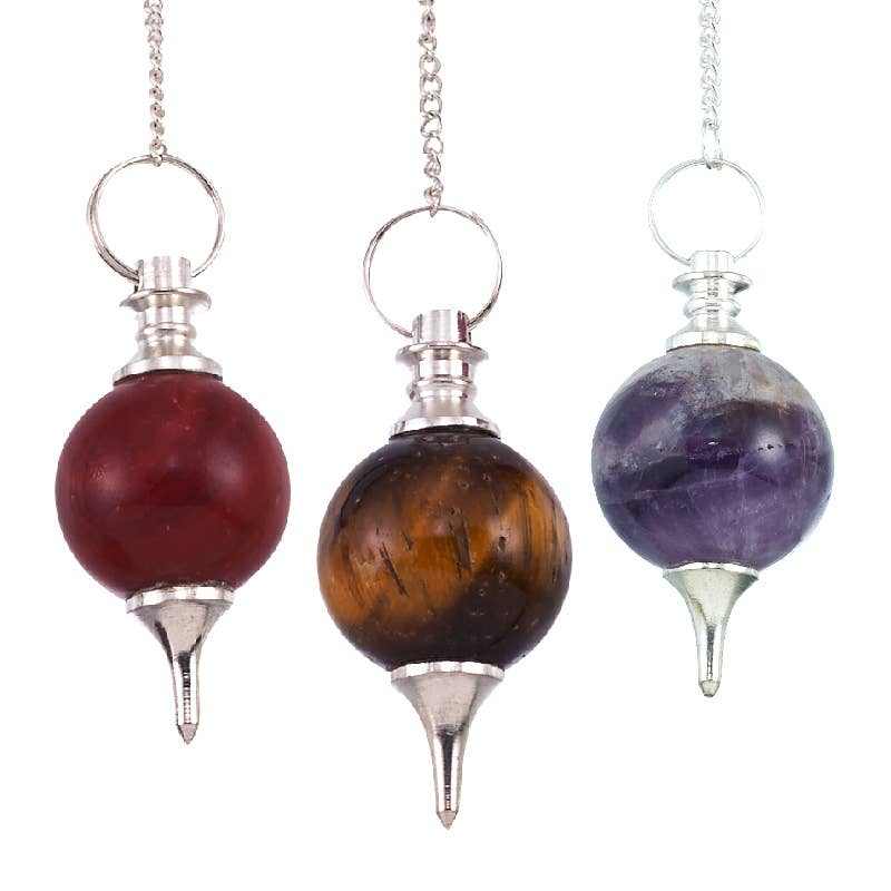 Ball pendulums with gemstone spheres on chains for spiritual wellness.