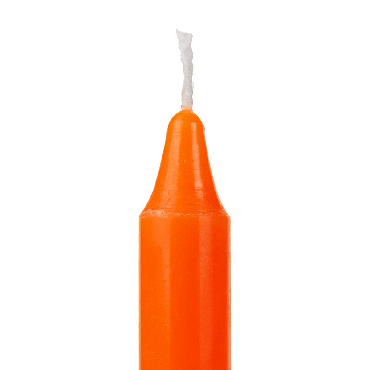 Orange candle with white wick on a white background