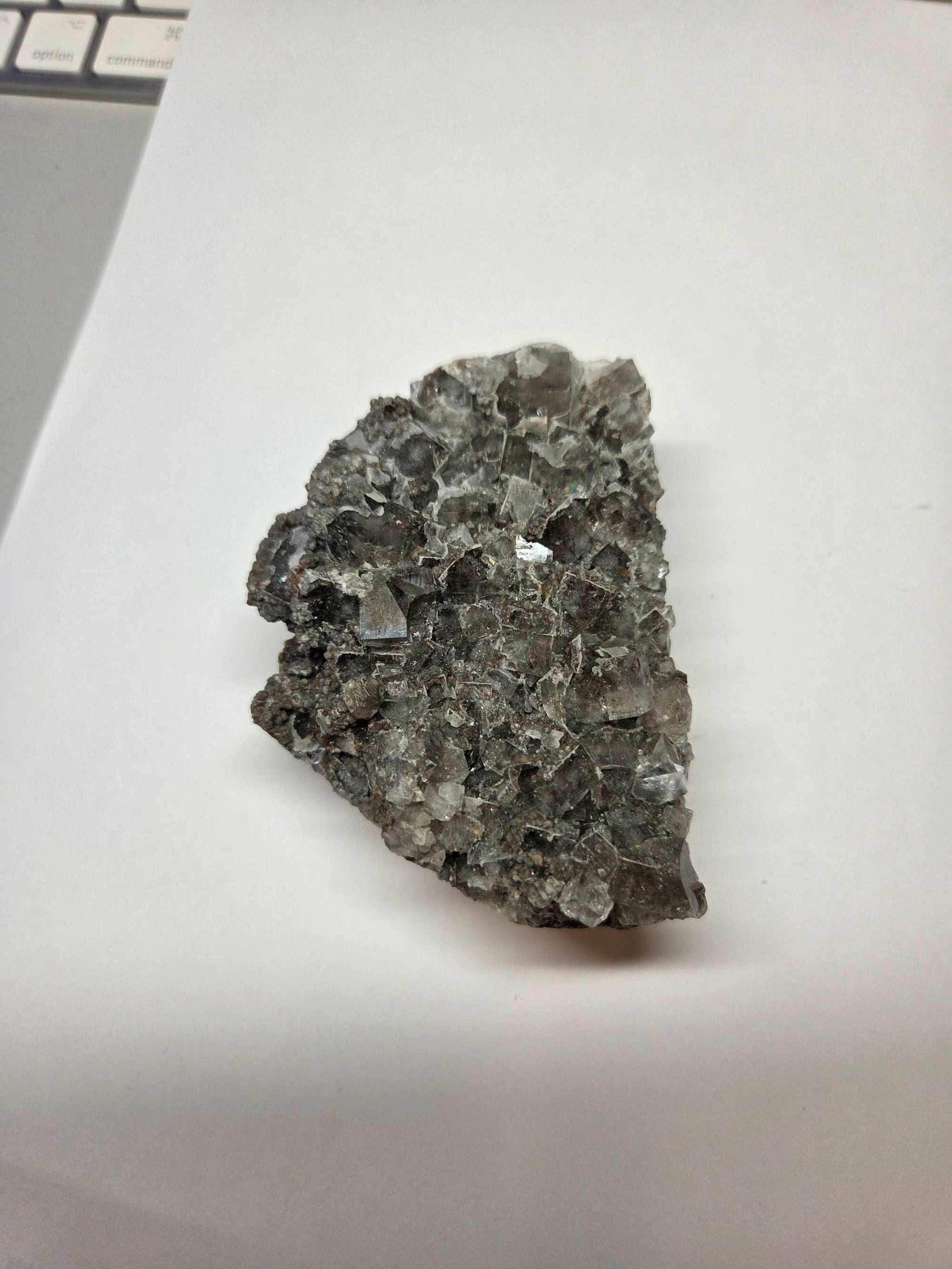 Clear Fluorite Specimen crystal with translucent and grayish hues on white background