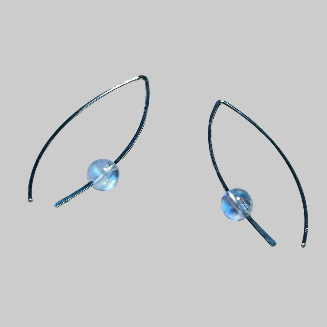 Sterling Silver earrings with round rainbow moonstone stone bead on a background, the rainbow moonstone is flashy!