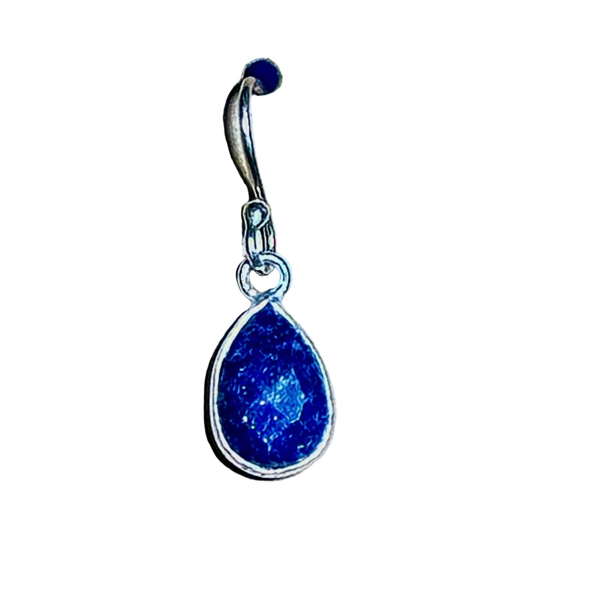 Blue Lapis Lazuli faceted teardrop earring in sterling silver setting on a background