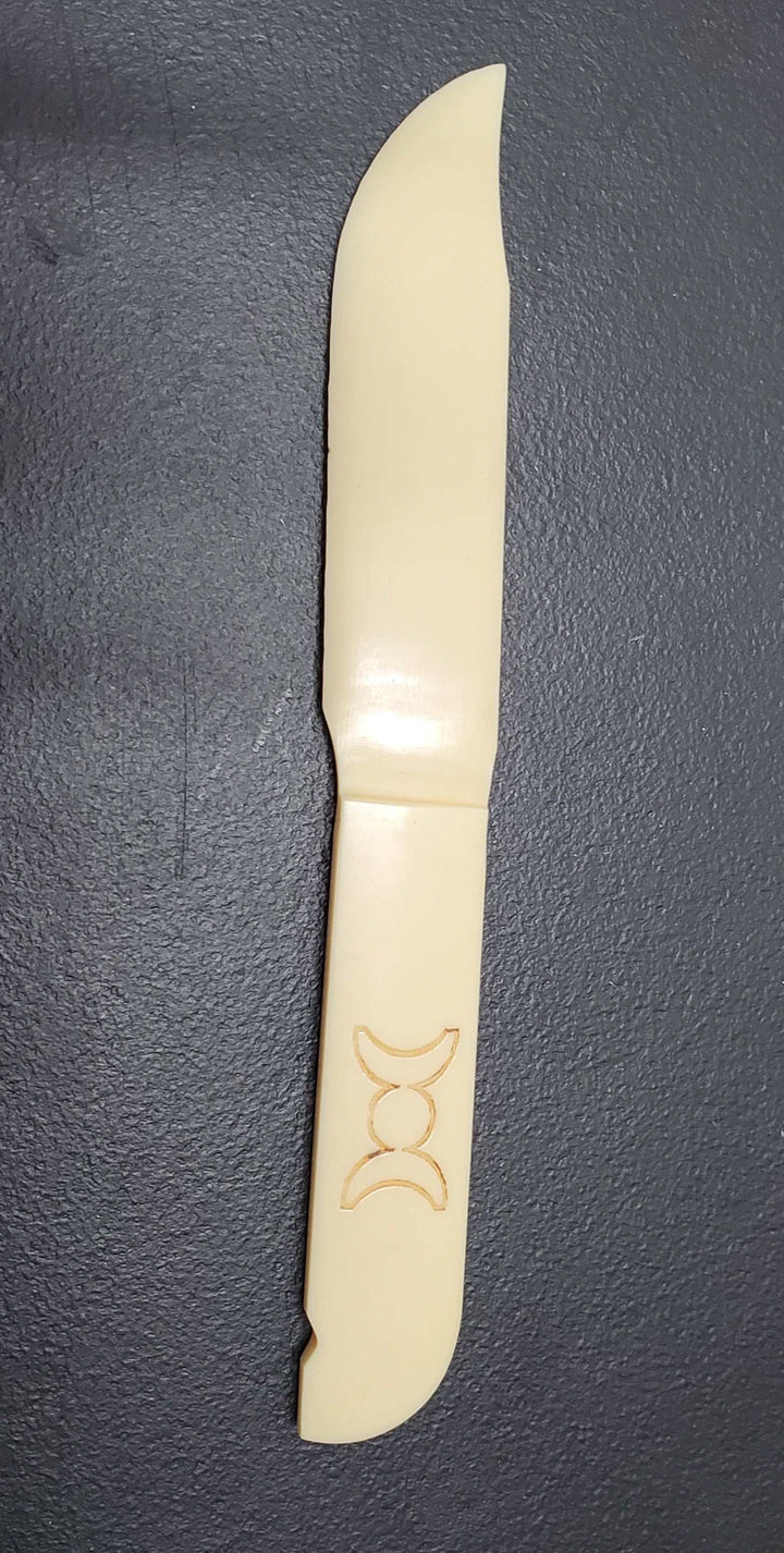 Triple Moon Acrylic Athame 7" Knife on display.