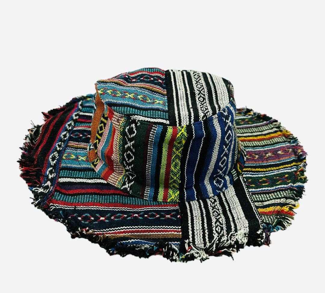 Colorful bucket hat with fringe trim and geometric patterns.