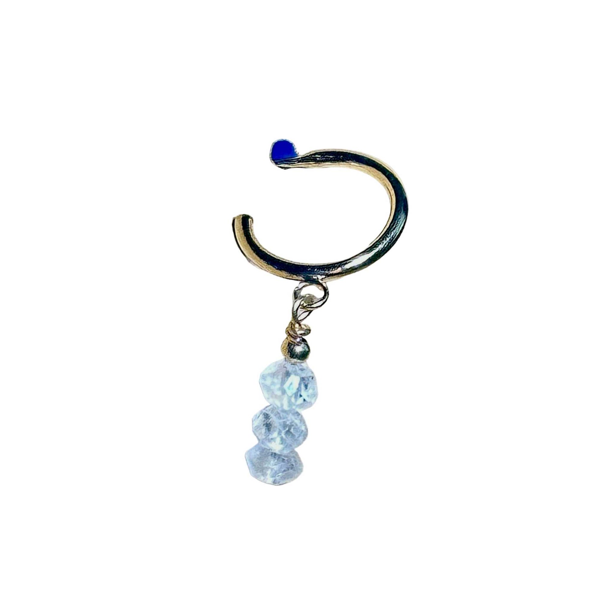 Gold hoop earring with Rainbow Moonstone gemstone faceted beads on a background