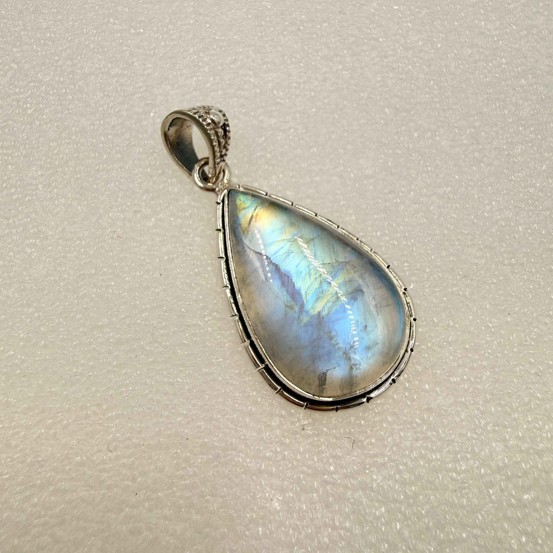 Sterling Silver Rainbow Moonstone Teardrop Pendant with Ornate Bezel