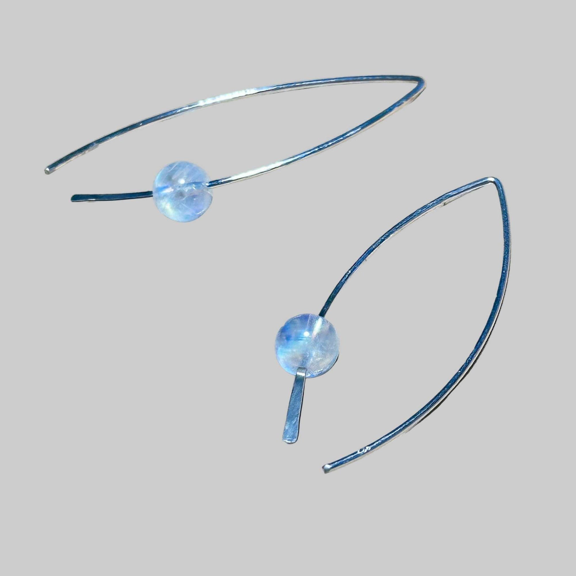 Sterling Silver earrings with round rainbow moonstone stone bead on a background, the rainbow moonstone is flashy!