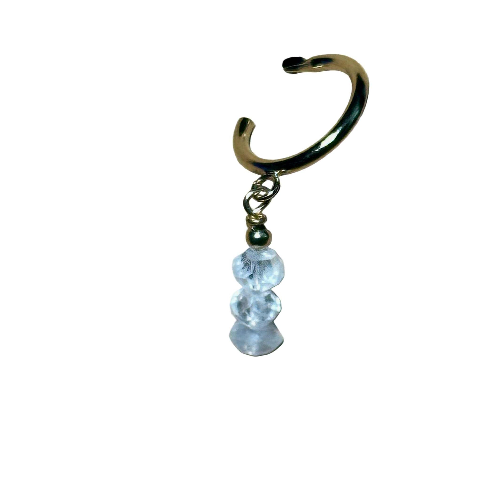 Hoop earring with Rainbow Moonstone gemstone faceted beads on a background