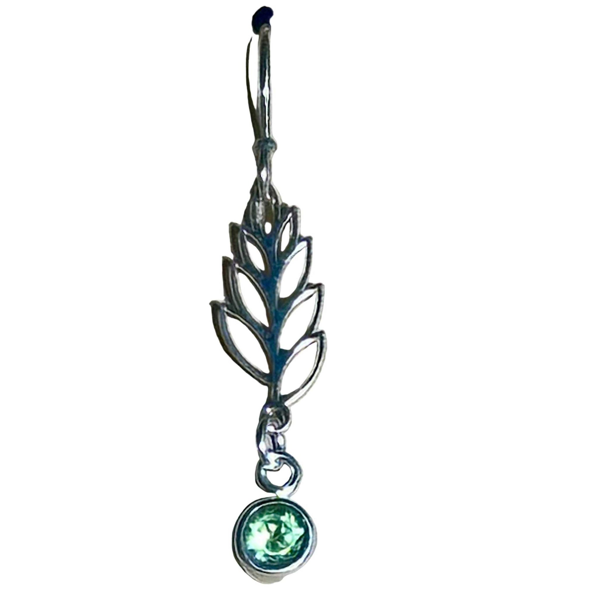 Silver leaf-shaped earring with a green Peridot gemstone on a white background