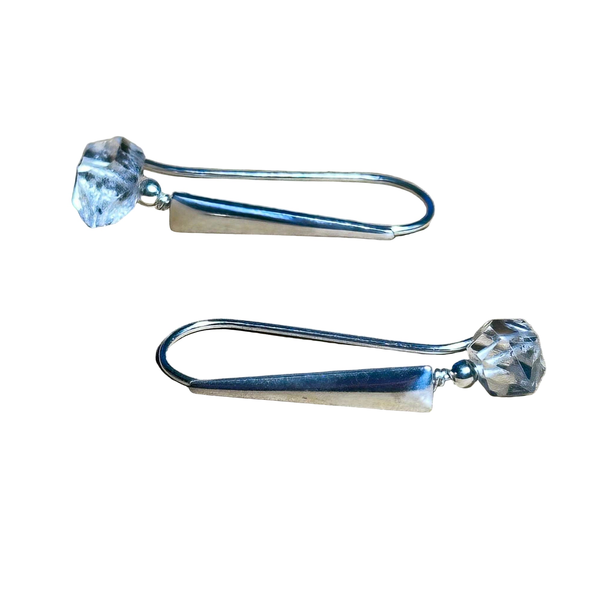 Simple Herkimer diamond earrings with sterling silver hooks on a neutral background