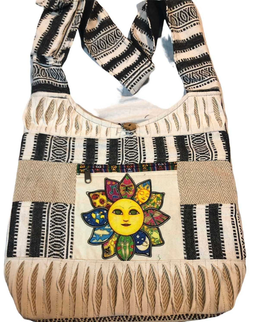 Sun Face Shoulder Bag with colorful sun motif and black and white patterned fabric, featuring a wide shoulder strap and spacious interior.