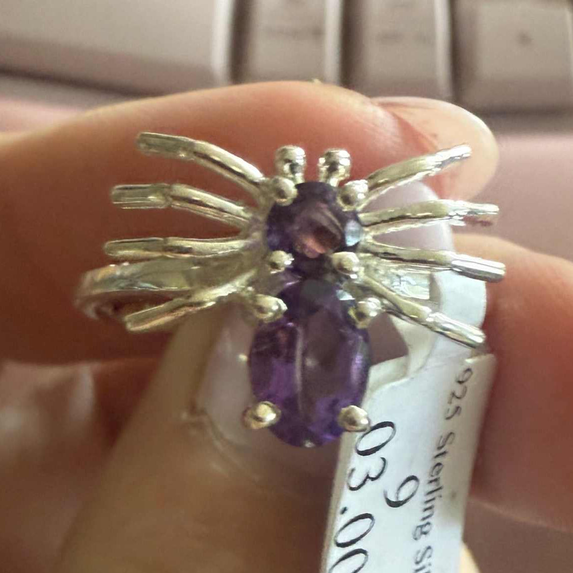 Spider ring with precious metal band and spider legs with gemstone spider body