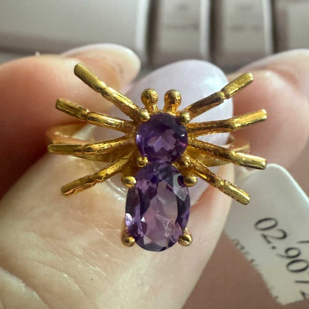 Spider ring with precious metal band and spider legs with gemstone spider body