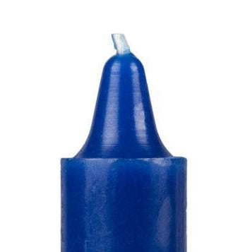 Blue candle with a white wick on a white background