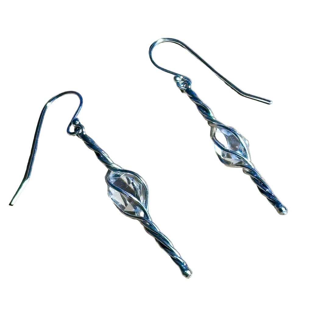 Limited Edition Herkimer swirl dangle earrings made of sterling silver with clear crystal center
