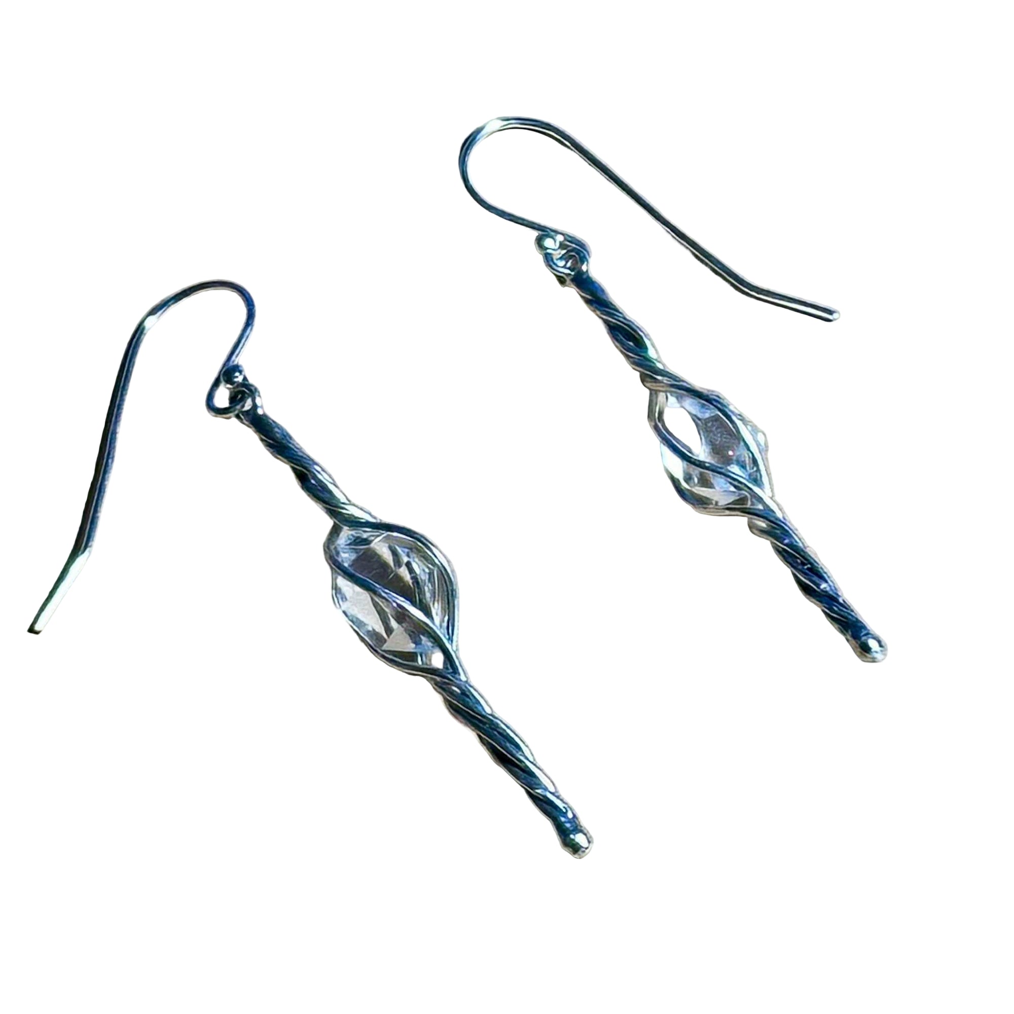 Limited Edition Herkimer swirl dangle earrings made of sterling silver with clear crystal center