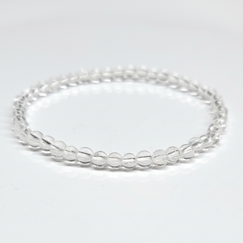Clear Quartz Bracelet 4mm with translucent beads for energy amplification and spiritual awareness.