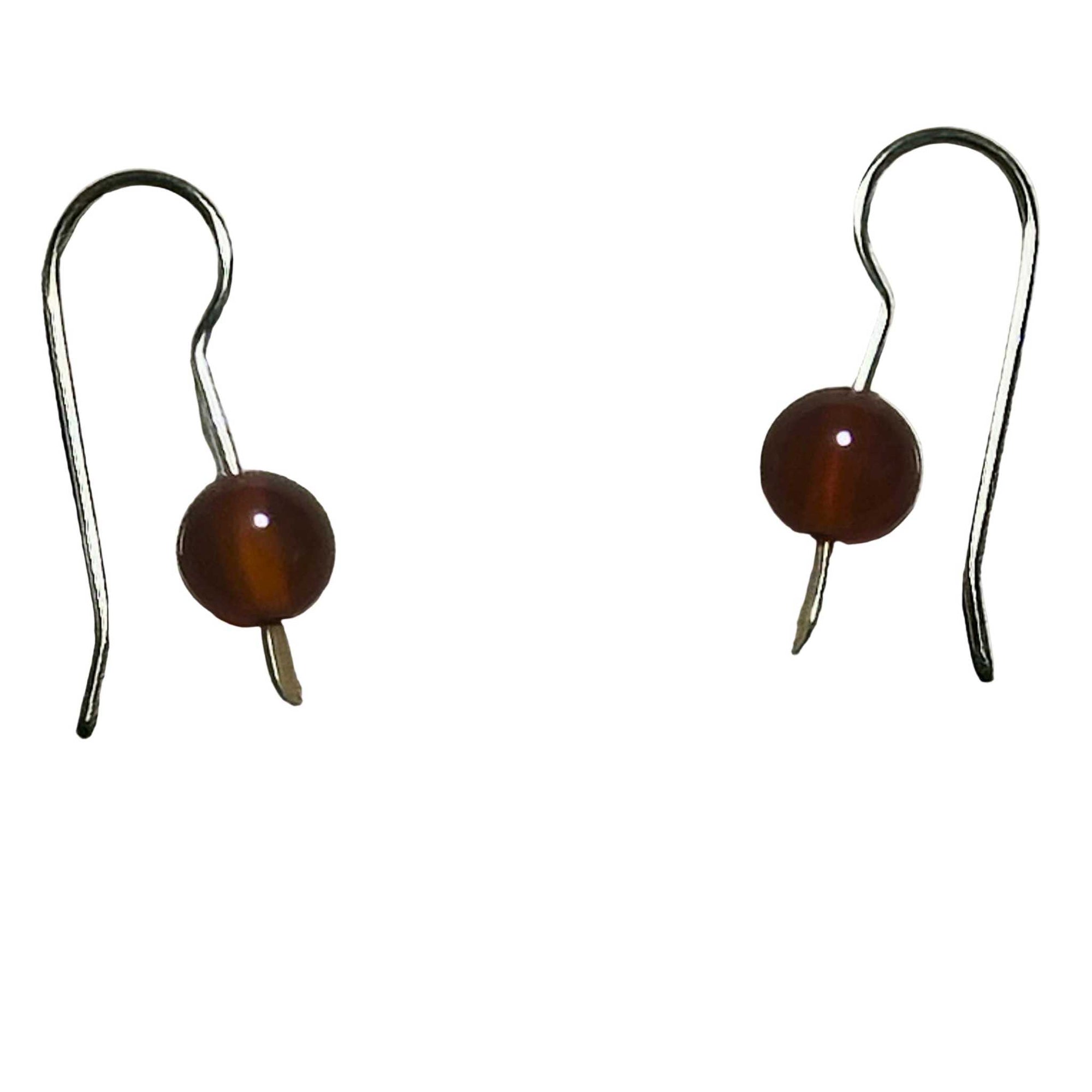 Gold Earrings with red Carnelian stones, on a background