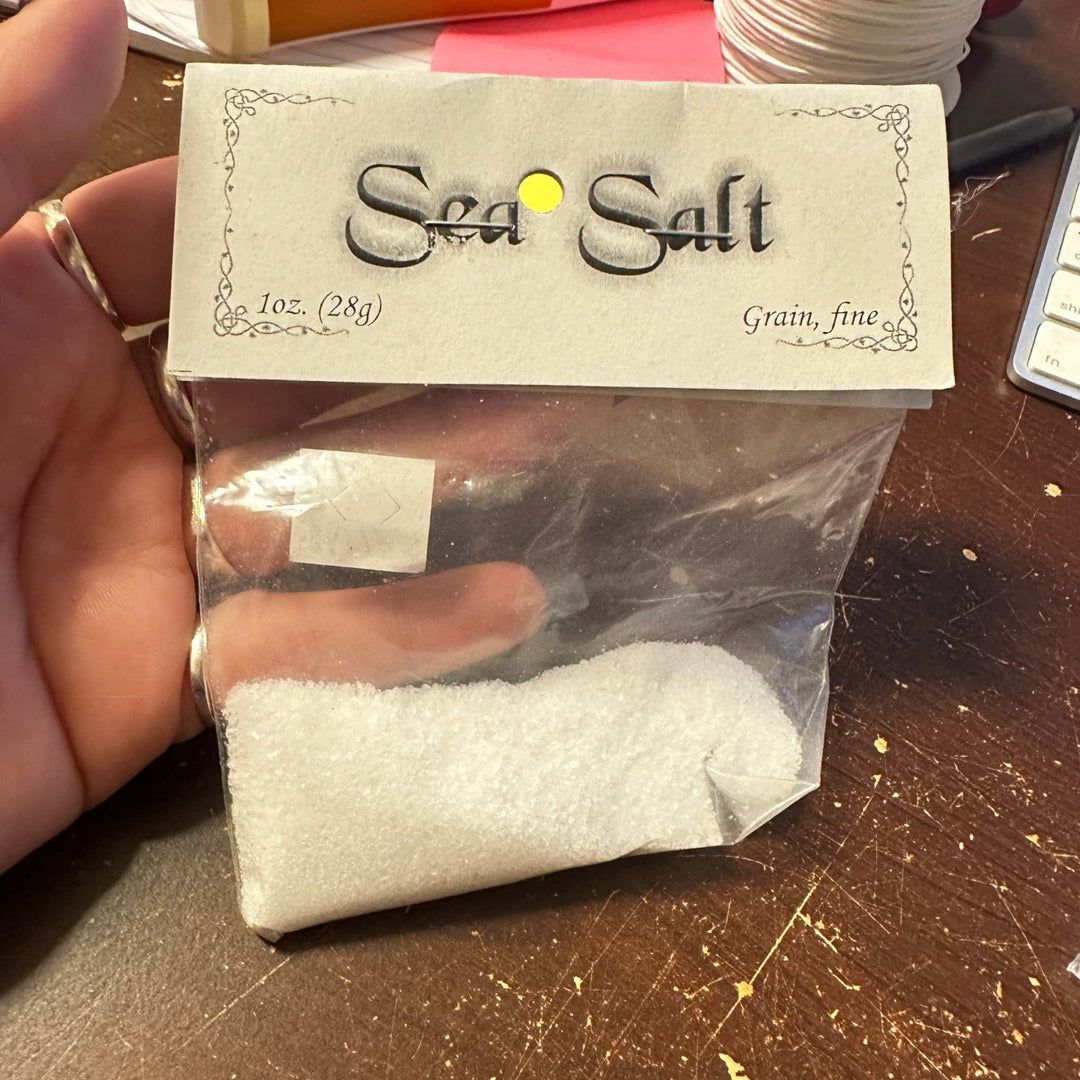 Sea Salt Fine Grain 1oz in a clear resealable bag, suitable for cosmetic blends and cleansing rituals.