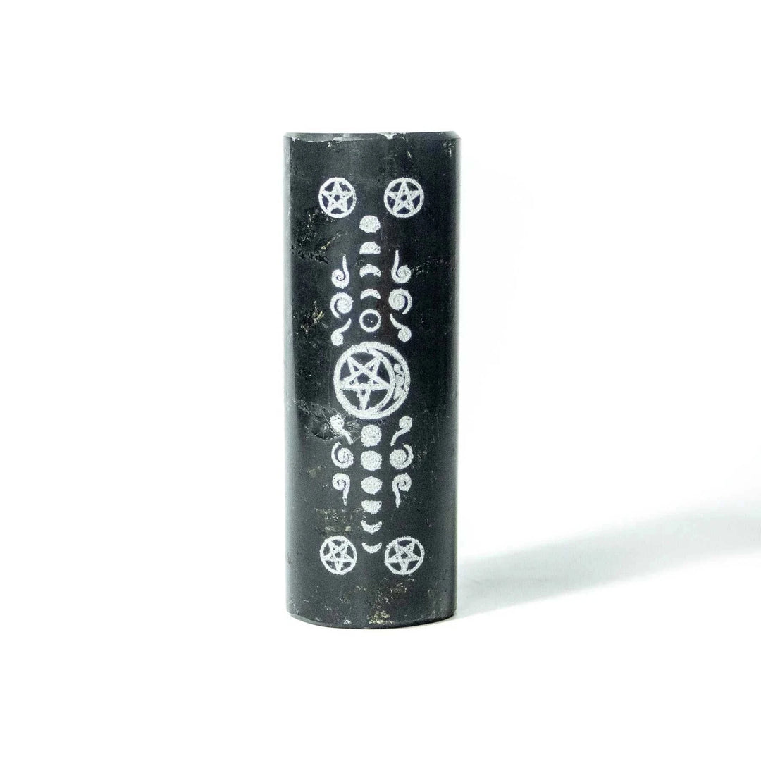 Black Tourmaline engraved with moon and pentacle symbols for meditation charging.