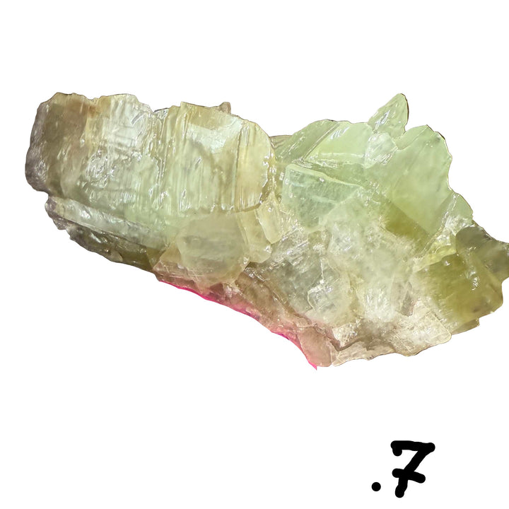 Green Calcite Specimen on wooden surface. .07