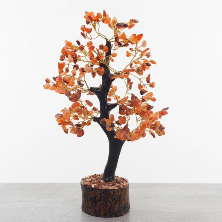 Small tree with orange Carnelian gemstone leaves on a white background