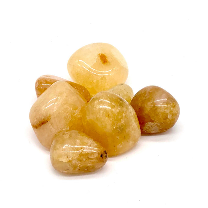 Golden Healer Quartz tumbled stones with radiant golden hues for clarity and spiritual connection.