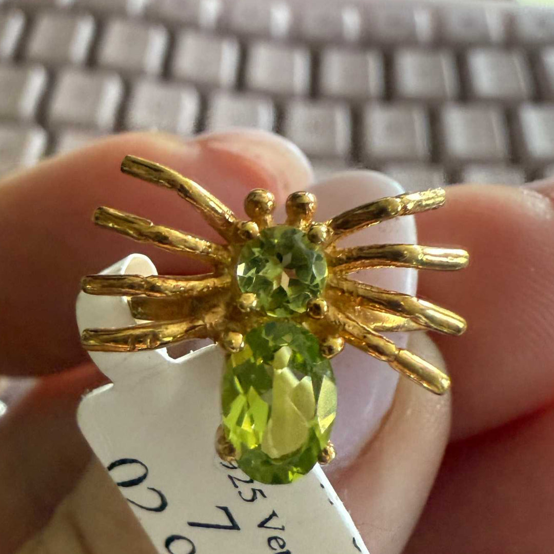 Spider ring with precious metal band and spider legs with gemstone spider body